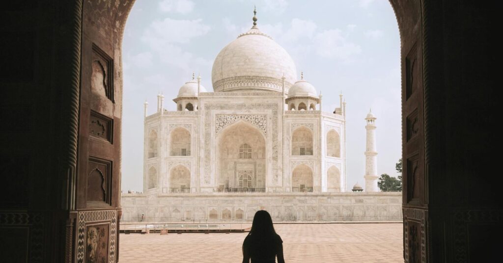 The iconic Taj Mahal glowing in the soft light of sunrise, a must-capture aesthetic photography spot in Agra.